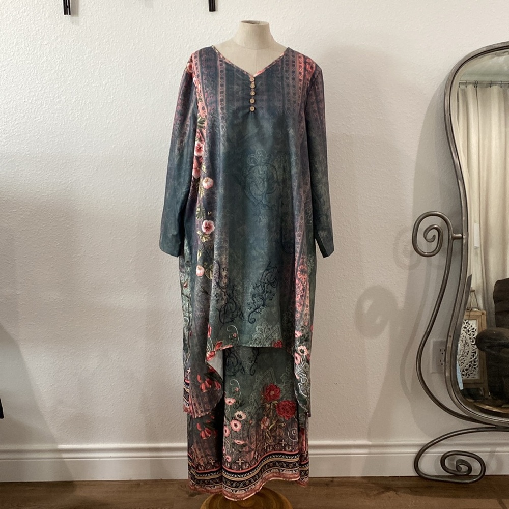 Long layered pullover dress. Floral in print. Polyester v neckline.